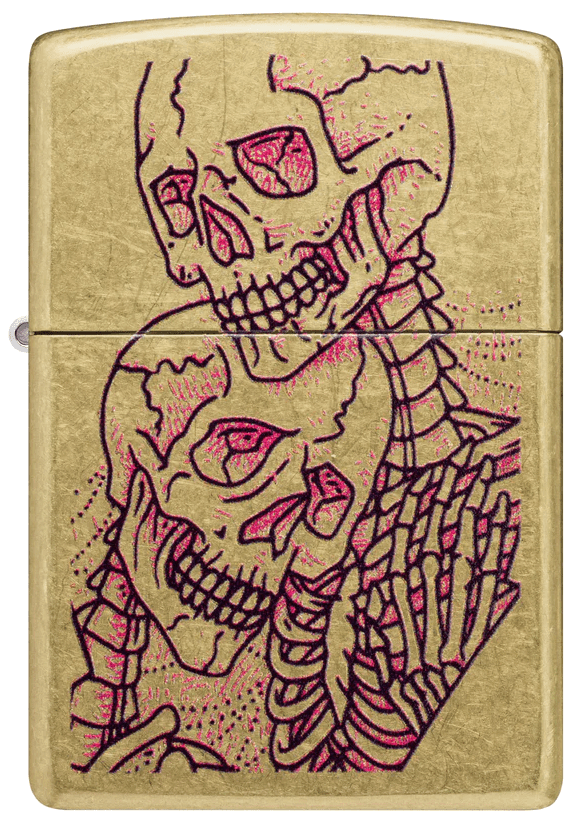 Brass-tone lighter with the twin-skull artwork from the supplied photograph.